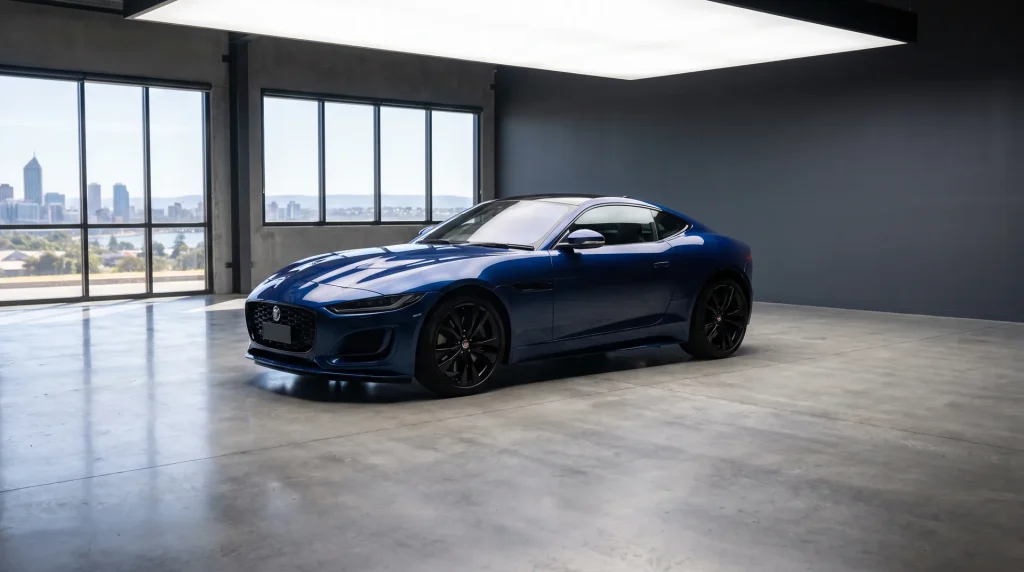 Professional car photography of a glossy blue sports coupe in a Perth studio with clean reflections